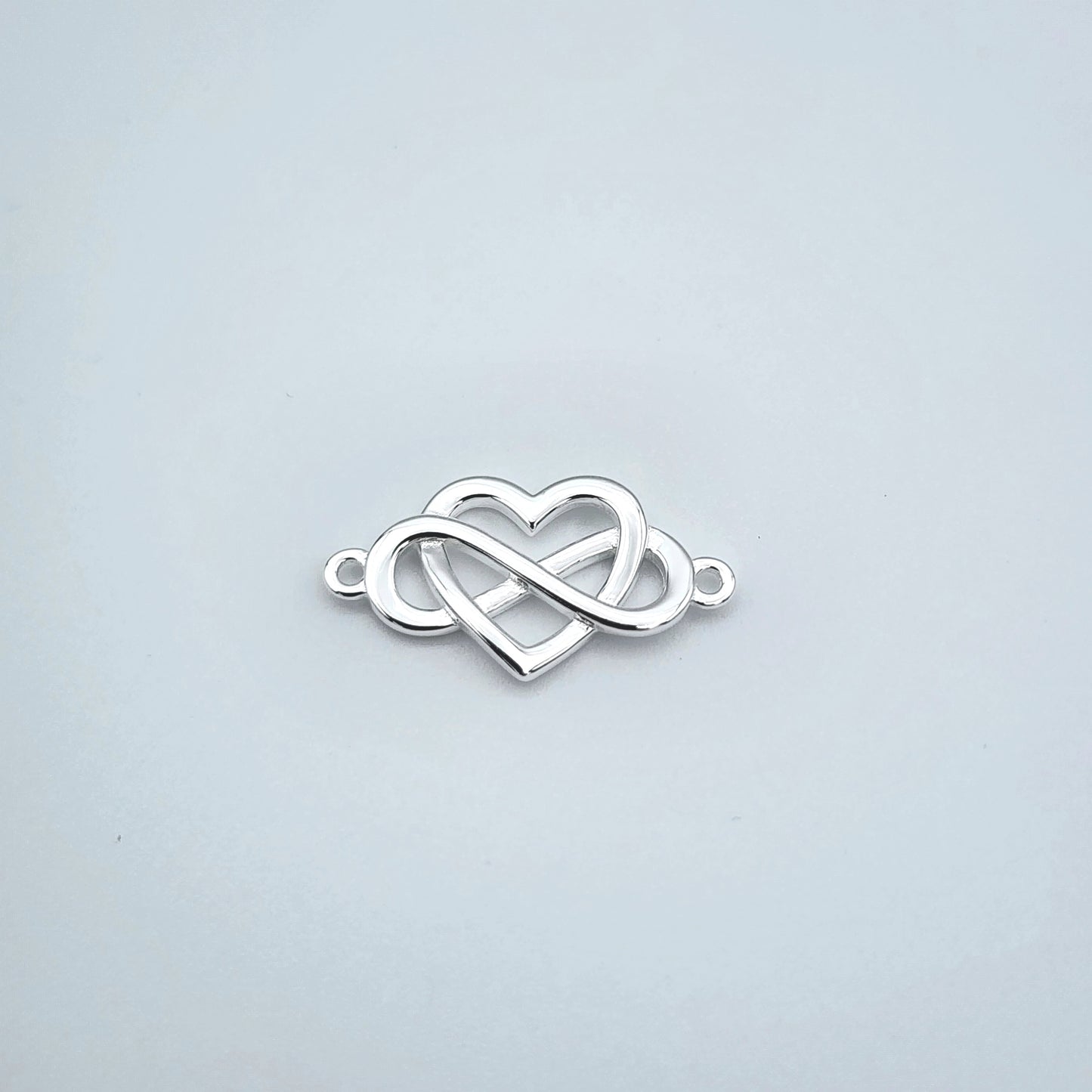 Silver infinity heart connector