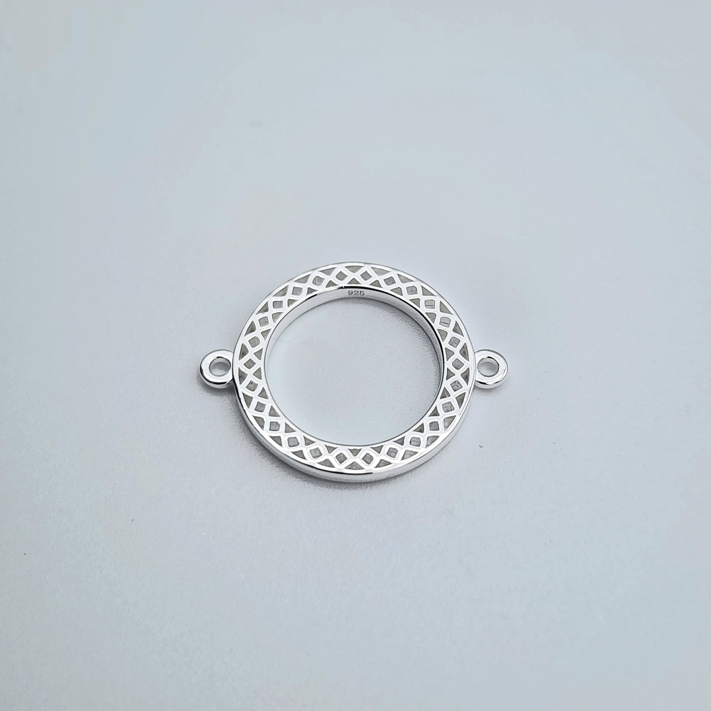 Silver round textured connector