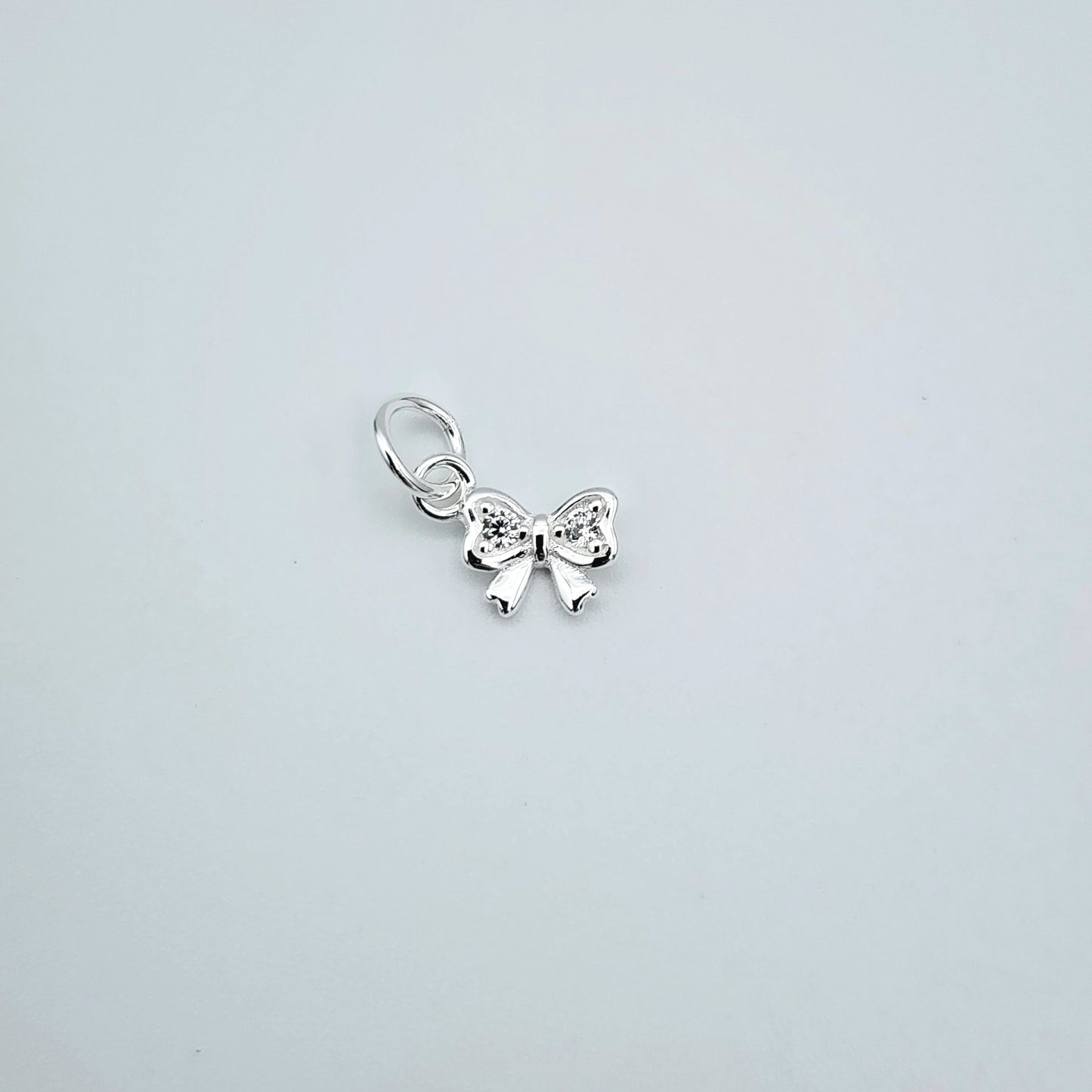 Silver cz bow charm