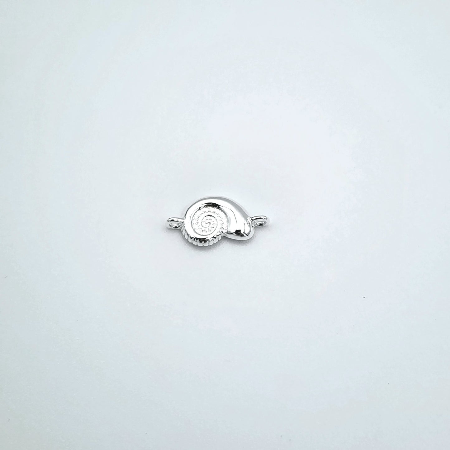Silver sea snail connector