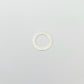 Silver ring with a textured band on a light gray background