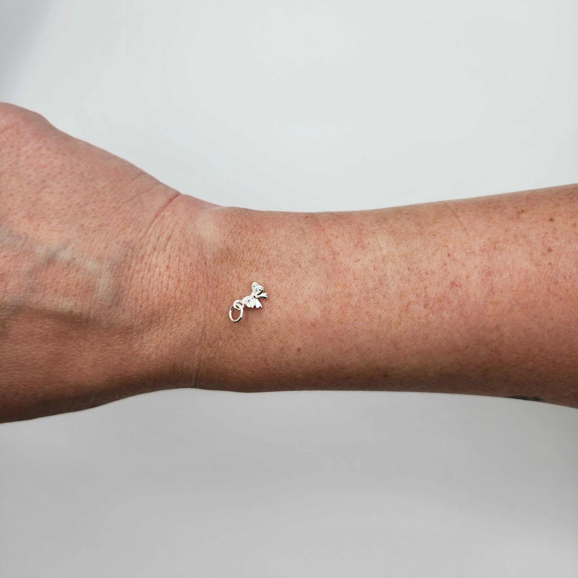 Silver cz bow charm size