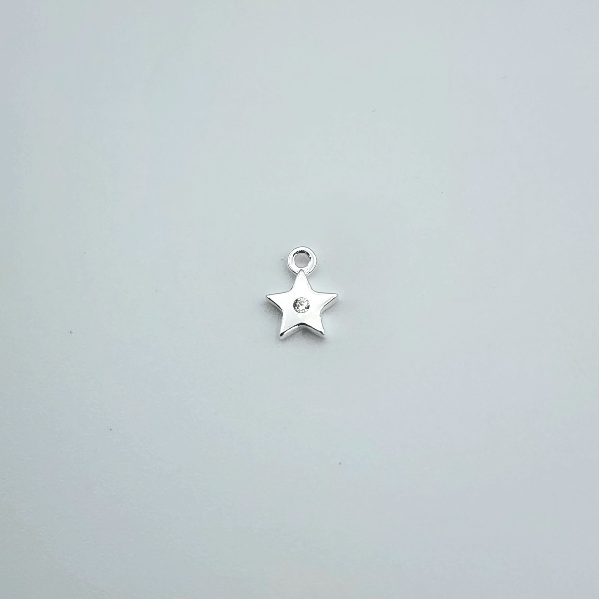 Silver star charm
