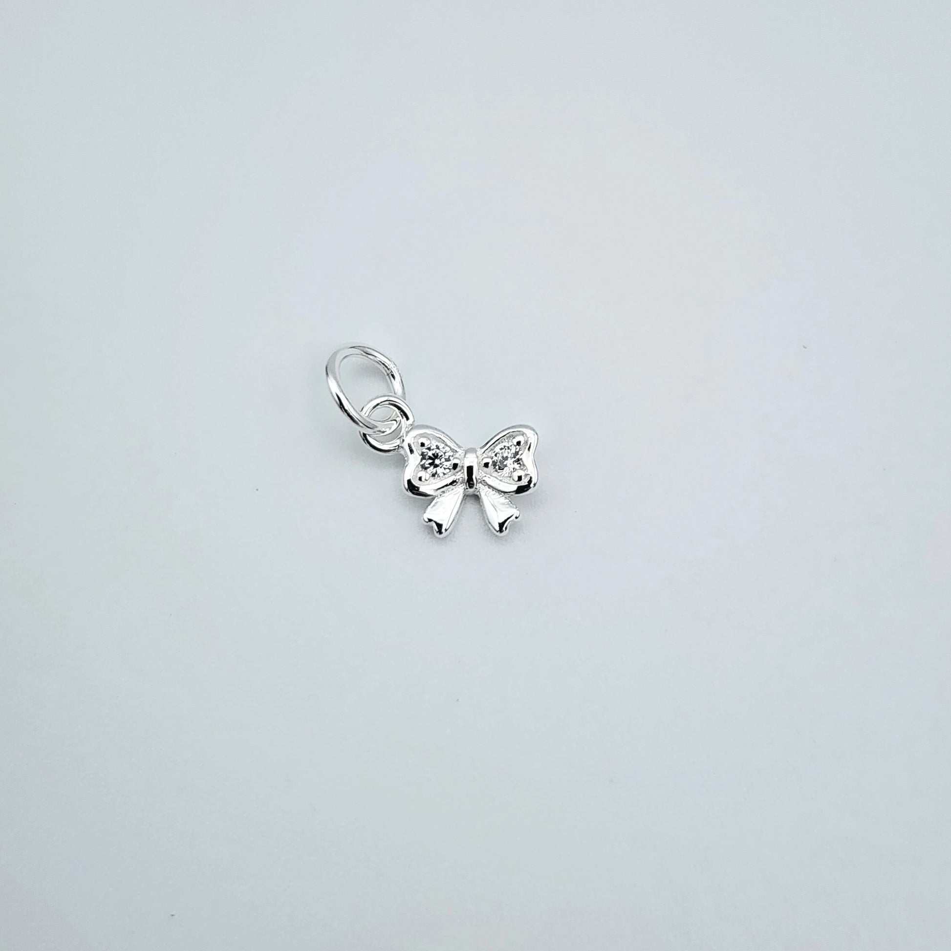 Silver cz bow charm